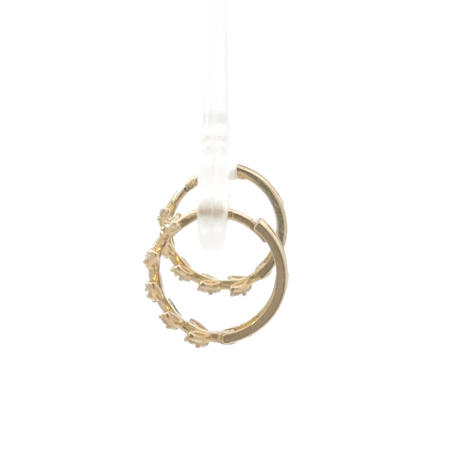 10K gold CZ earrings displayed on a soft velvet background, emphasizing the delicate design