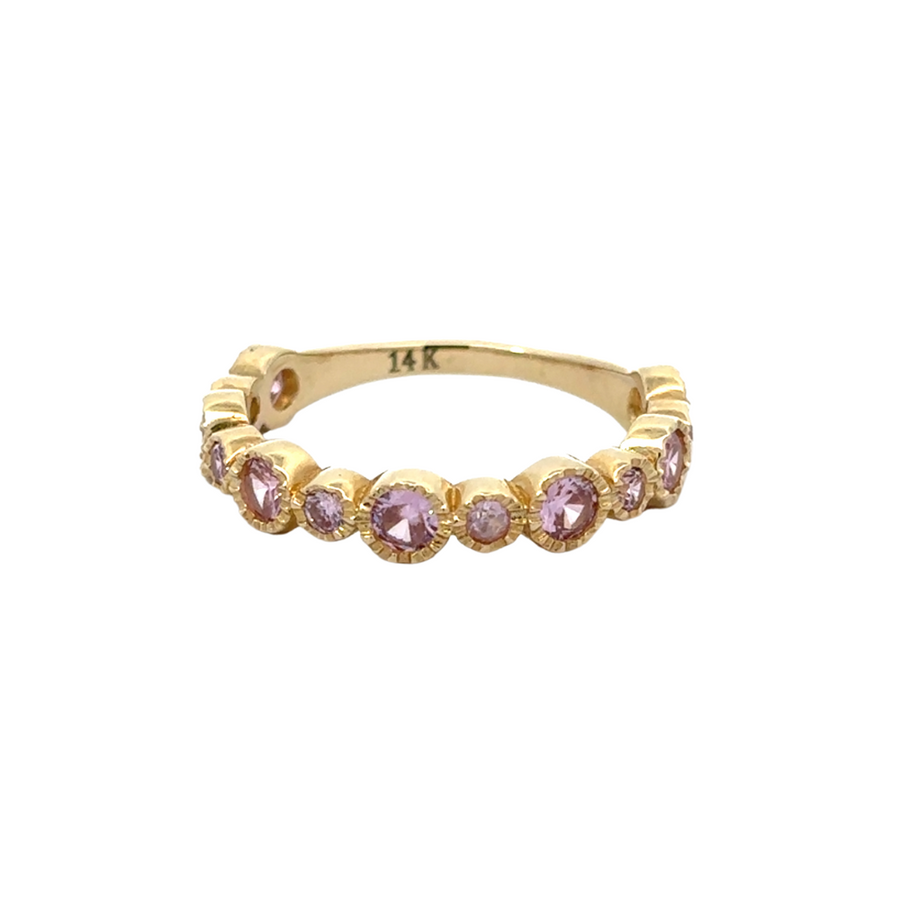 Close-up of the 14K gold aro ring featuring a shimmering rose CZ