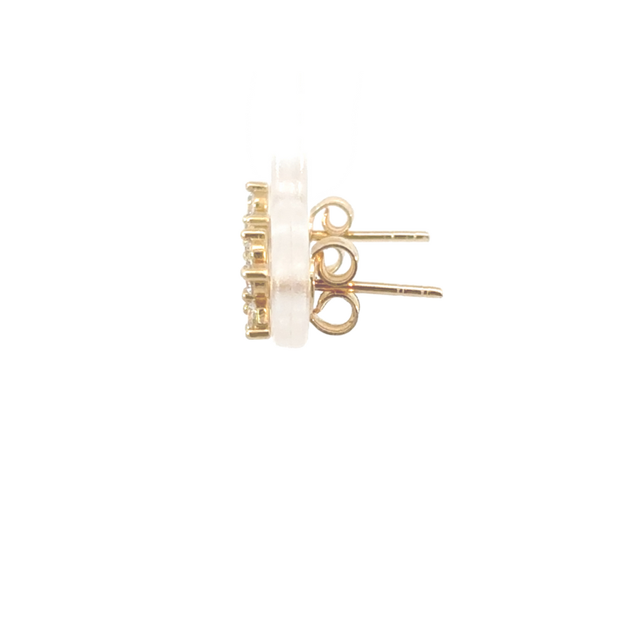 Side profile of 14K gold flower stud earrings with CZ stones, showcasing feminine charm