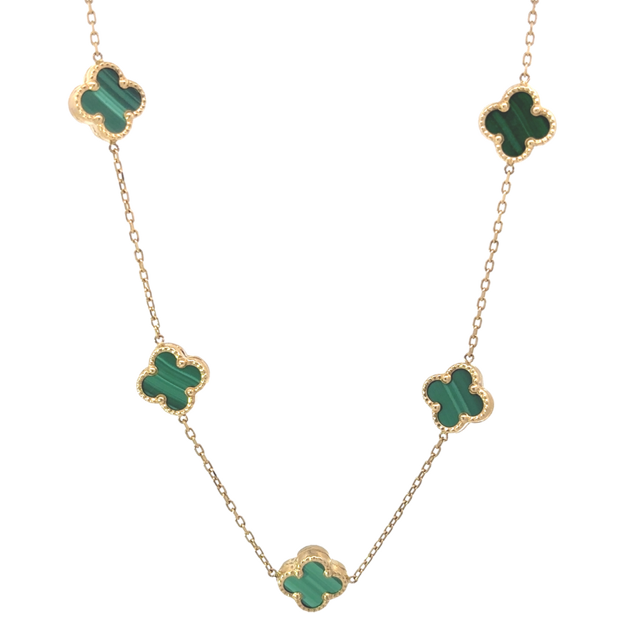 Close-up of the green floral details on the 14K gold necklace
