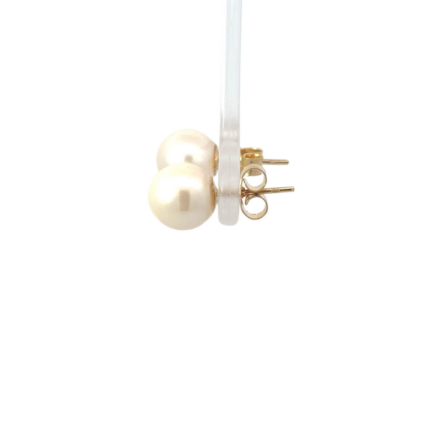 Classic pearl stud earrings set in 14K gold, perfect for special occasions