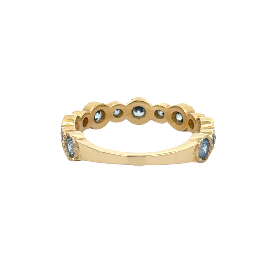 Stackable 14K gold ring with vibrant blue CZ centerpiece