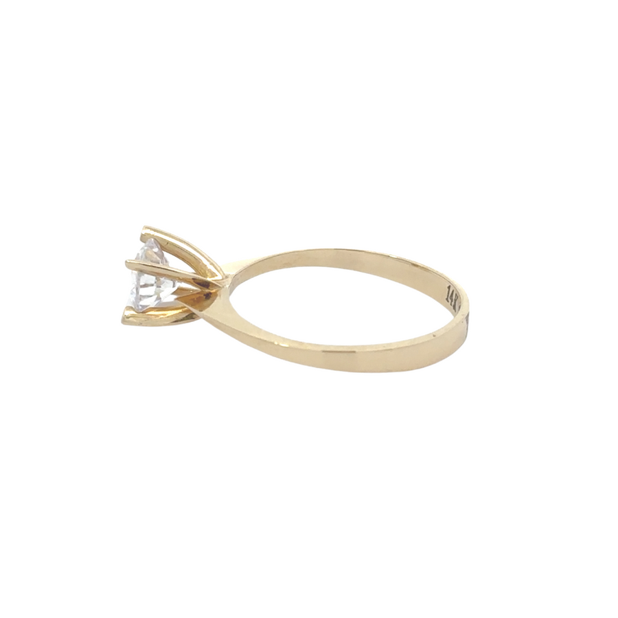 Side view of the 14K gold solitaire ring, featuring a classic solitaire setting