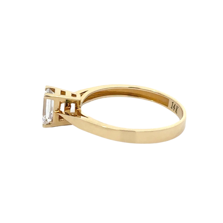 Side view of the 14K gold solitaire ring, emphasizing the high-polish finish