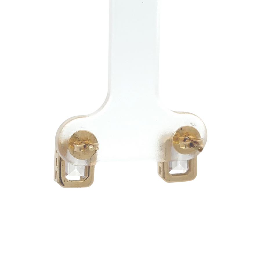 14K gold stud earrings displayed on a jewelry stand, showcasing their timeless appeal