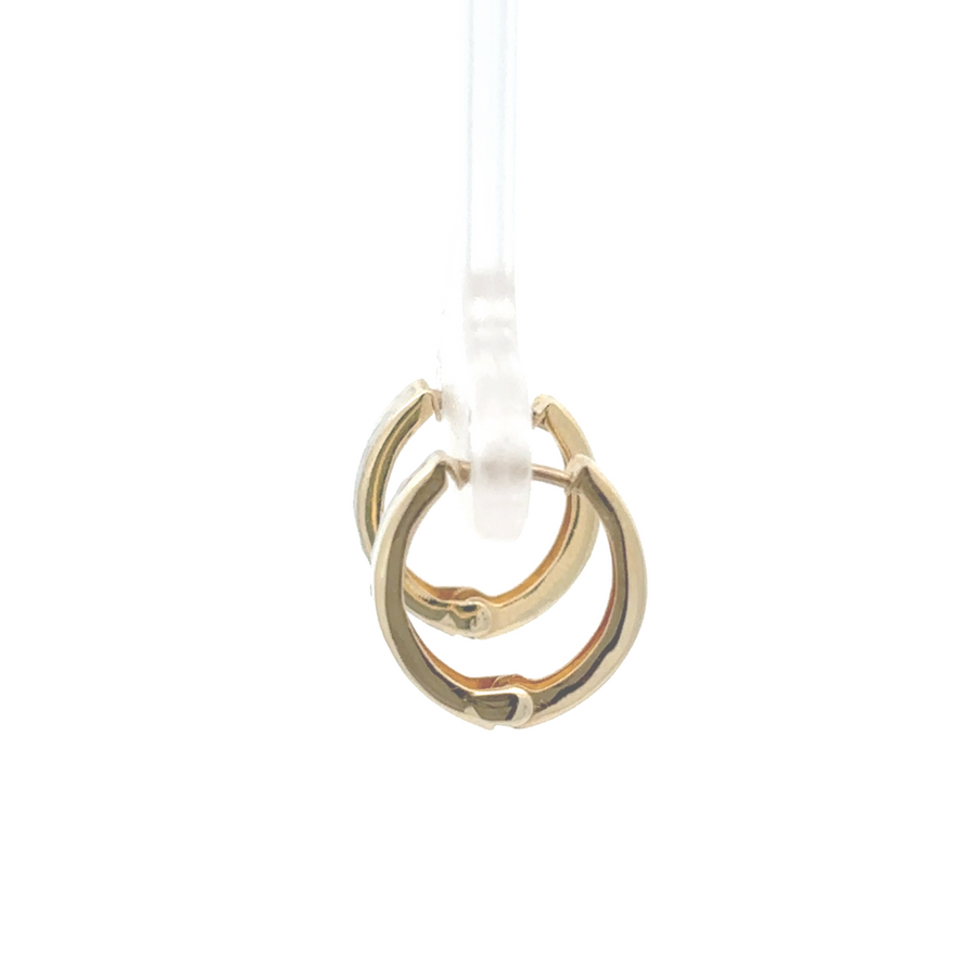 Side view of small 14K gold huggie earrings with secure clasp