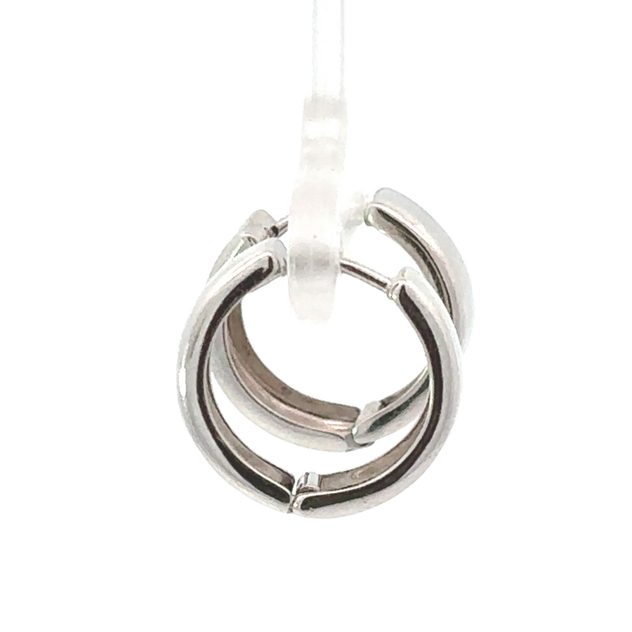 Delicate 14K white gold huggie earrings on display, perfect for everyday wear