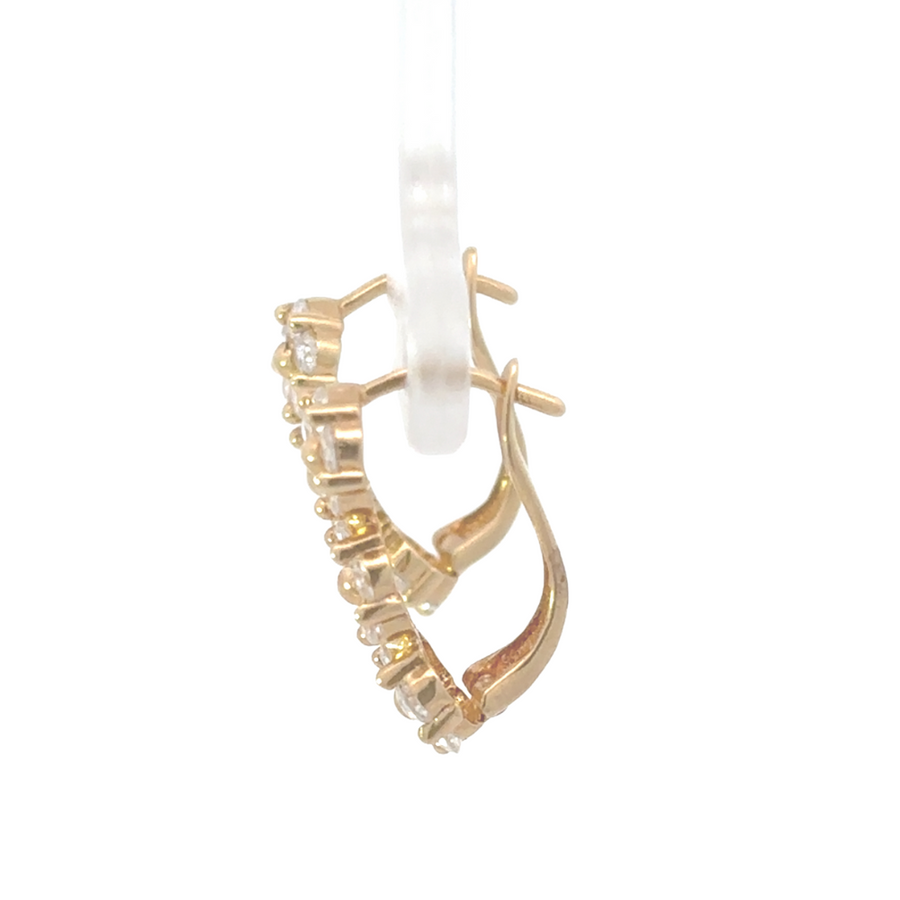 Side view of 14K yellow gold earrings showcasing delicate flower design