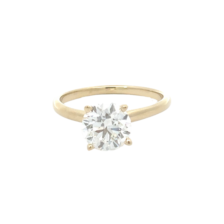 Close-up view of 14K yellow gold ring featuring a radiant 1.54 CT lab diamond