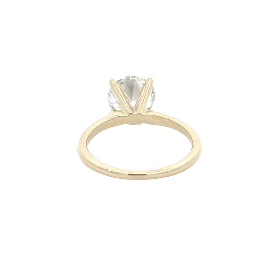 Elegant packaging of 14K yellow gold diamond ring on velvet display