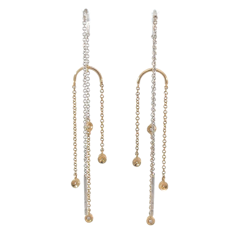 Jewelry flat lay of 14k gold CZ earrings with two-tone finish