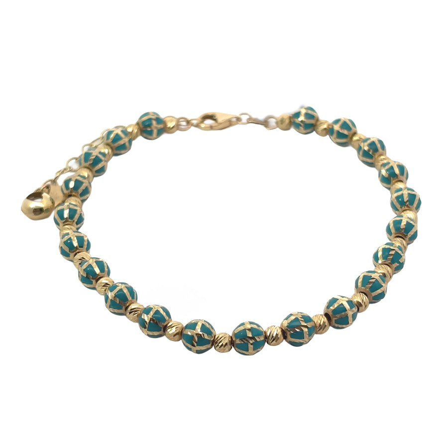 Bracelet laid flat showing gold balls and adjustable chain