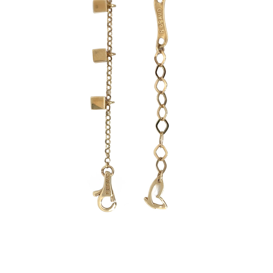 Side view of 14k gold bracelet with sparkling white stone