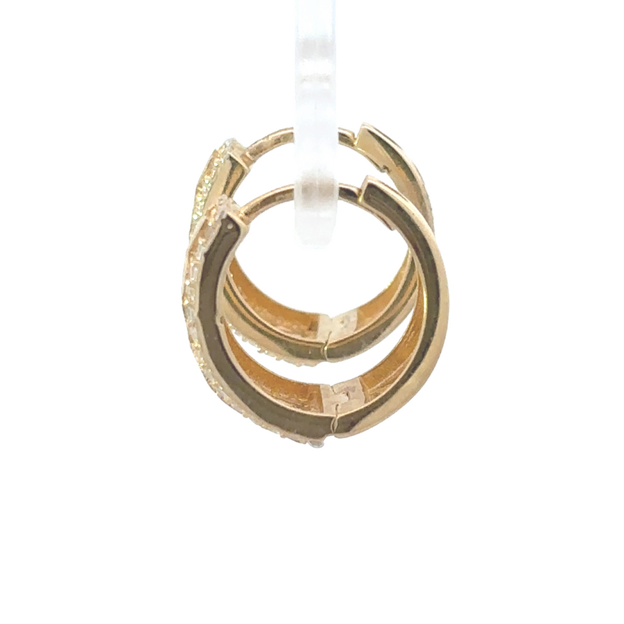 Side view of lightweight gold flower earrings with hoop design