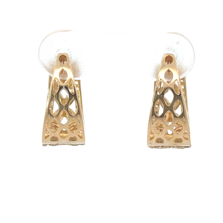 Pair of gold flower earrings displayed in a jewelry box with soft lining
