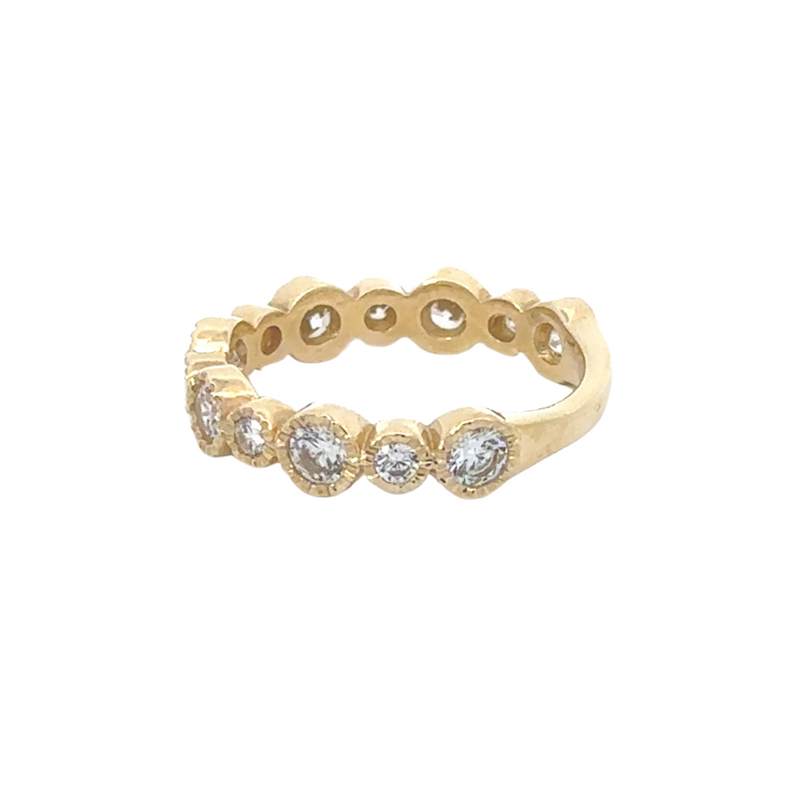 Elegant 14k gold aro ring with CZ stones, displayed on a velvet ring tray