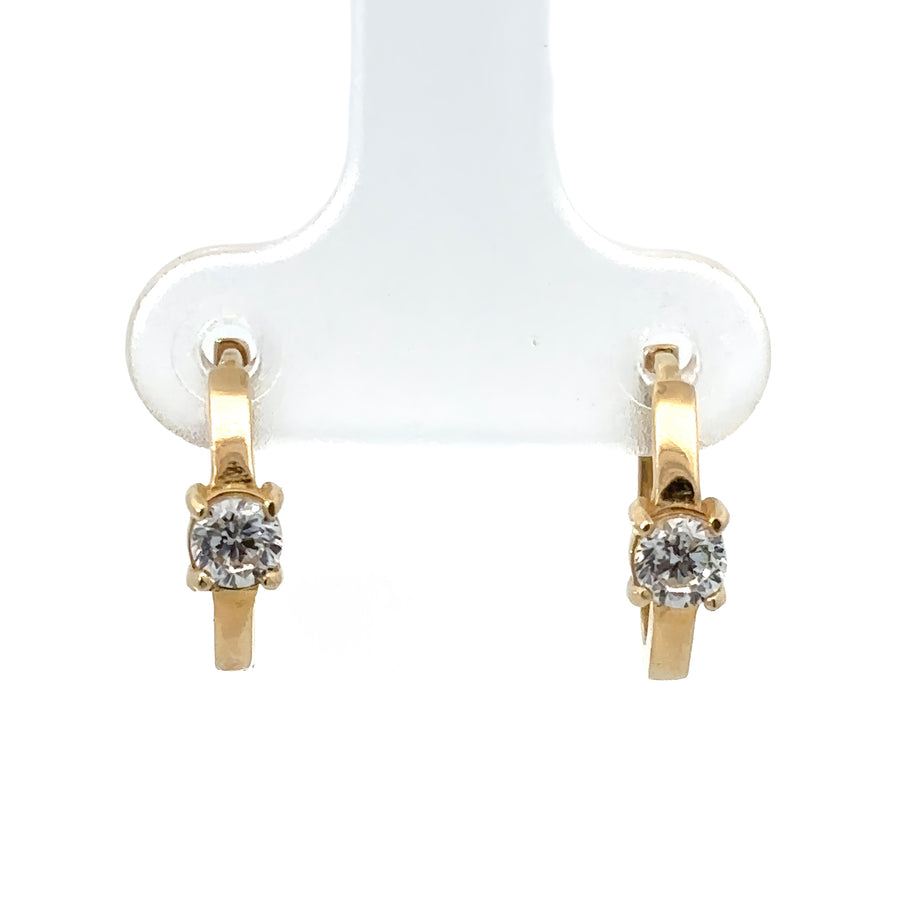 Close-up of baby earrings with small sparkling stone