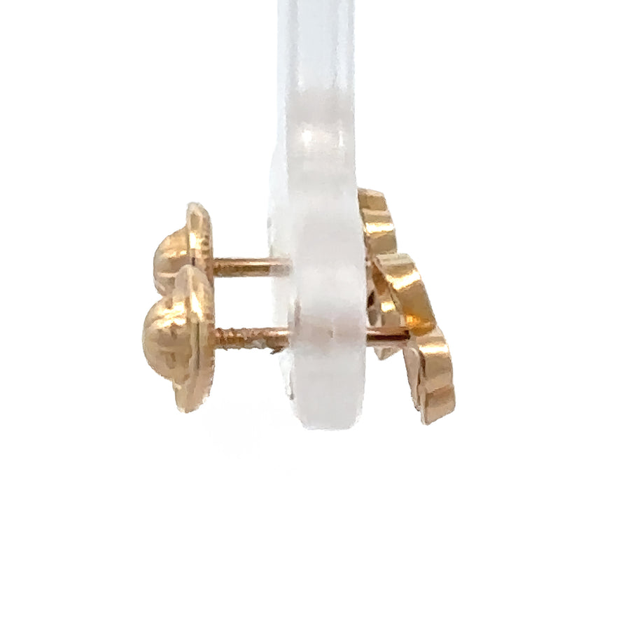 Solid gold baby studs featuring classic bow design
