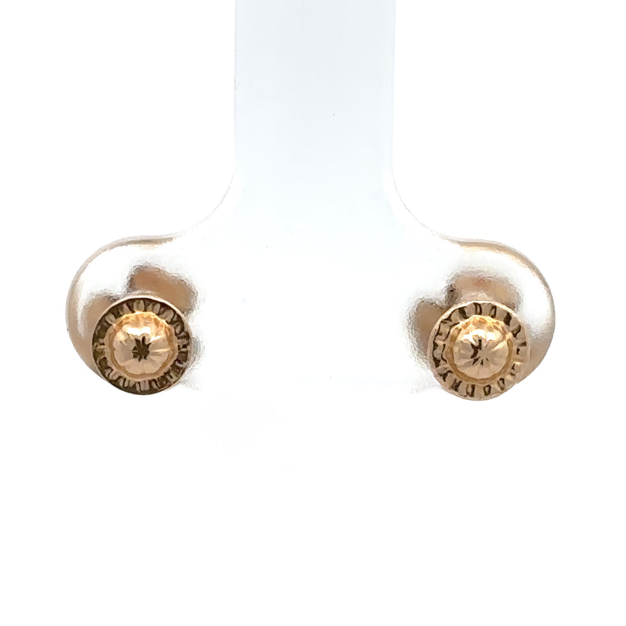 Elegant bow stud earrings shown in jewelry box