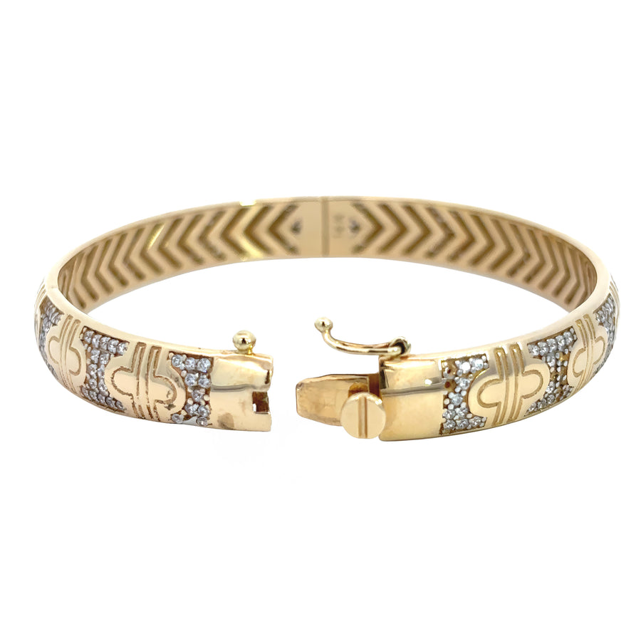 Stack of bracelets including 14k gold bangle