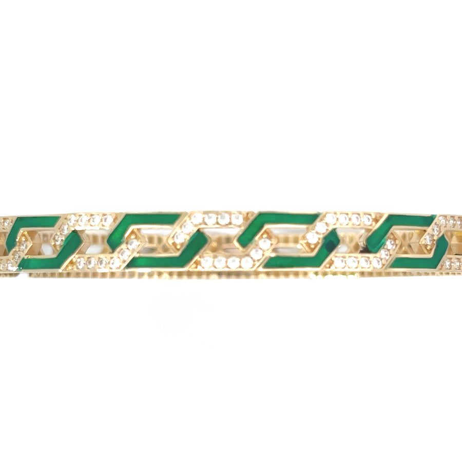 Close-up of green enamel and diamond on 14k gold bangle