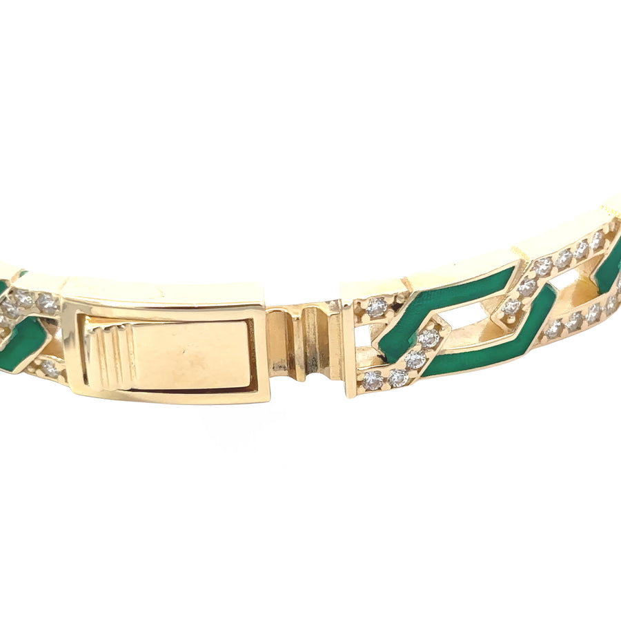 Elegant 14k gold bangle featuring vibrant green enamel
