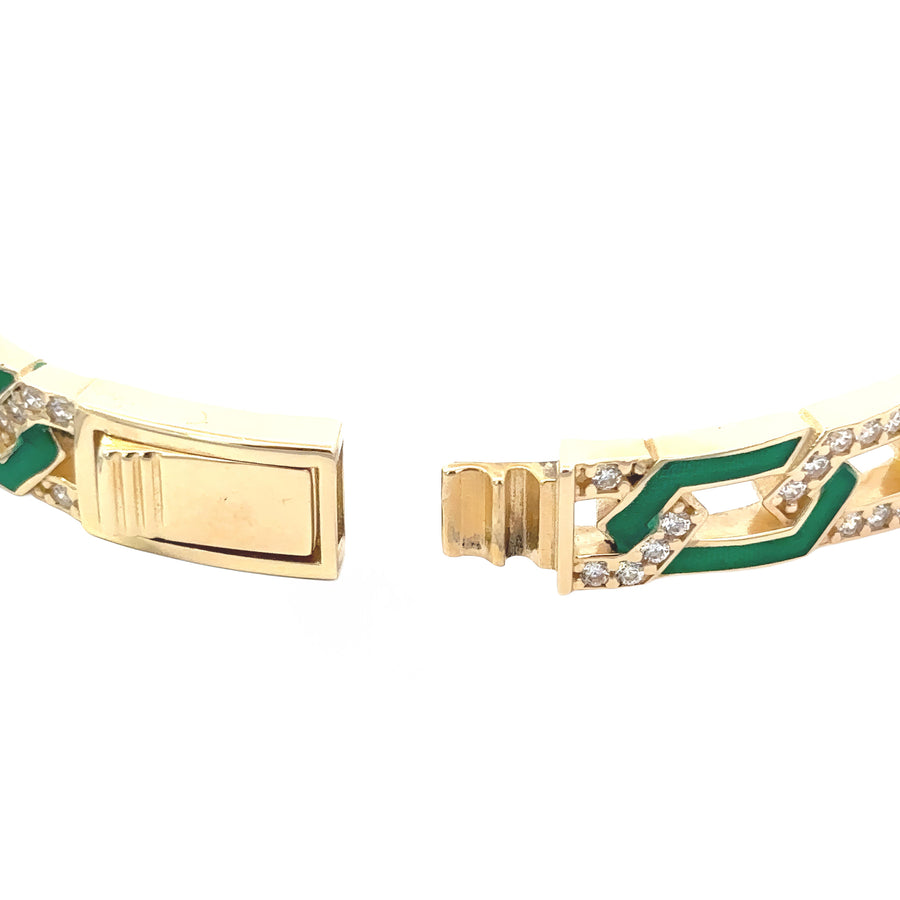Women’s 6 cm 14k gold bangle with diamond detail on wrist