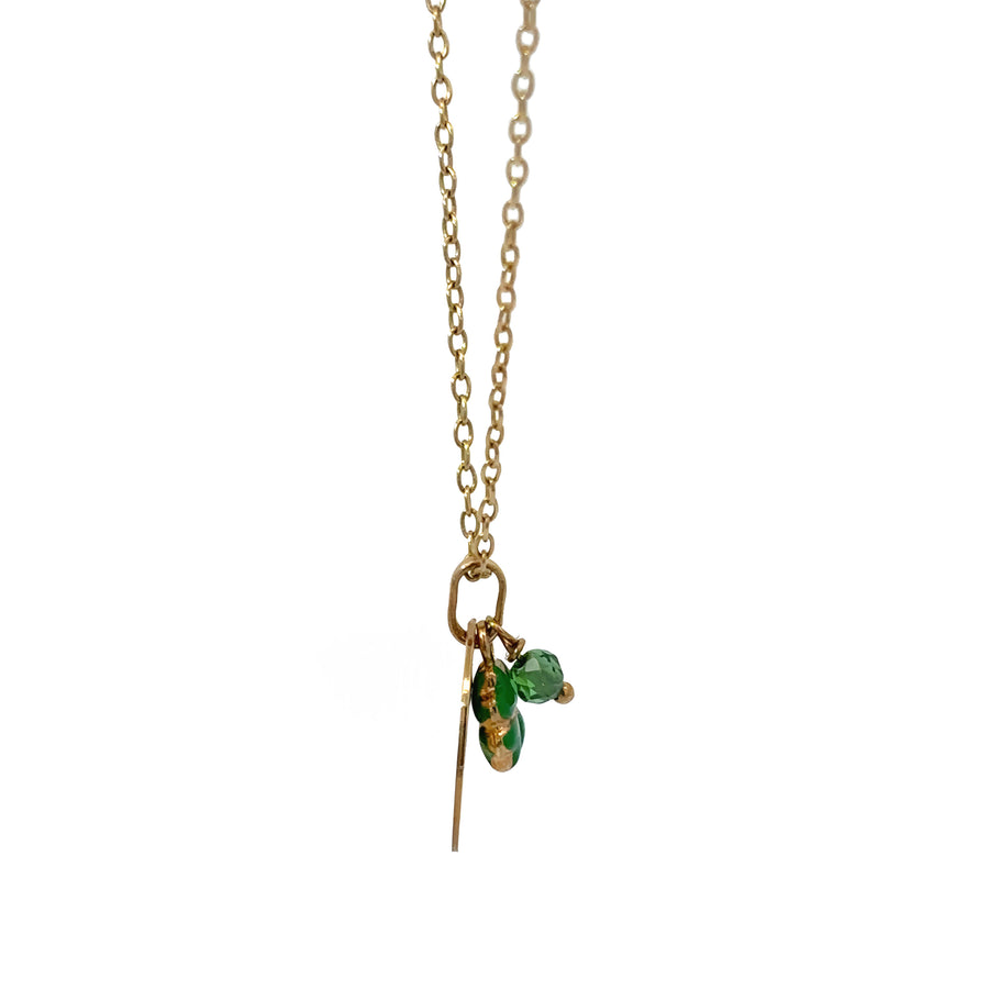 Close-up of delicate 14k gold necklace with "Be Sweet" pendant