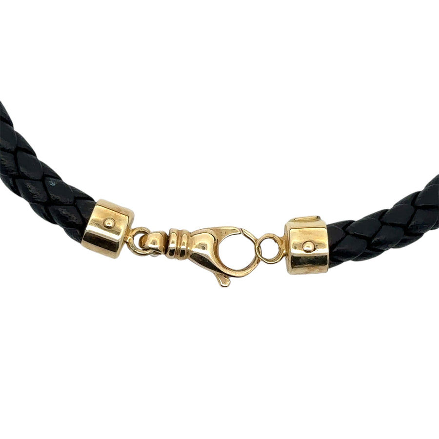 Black leather bracelet for men featuring gold detailing