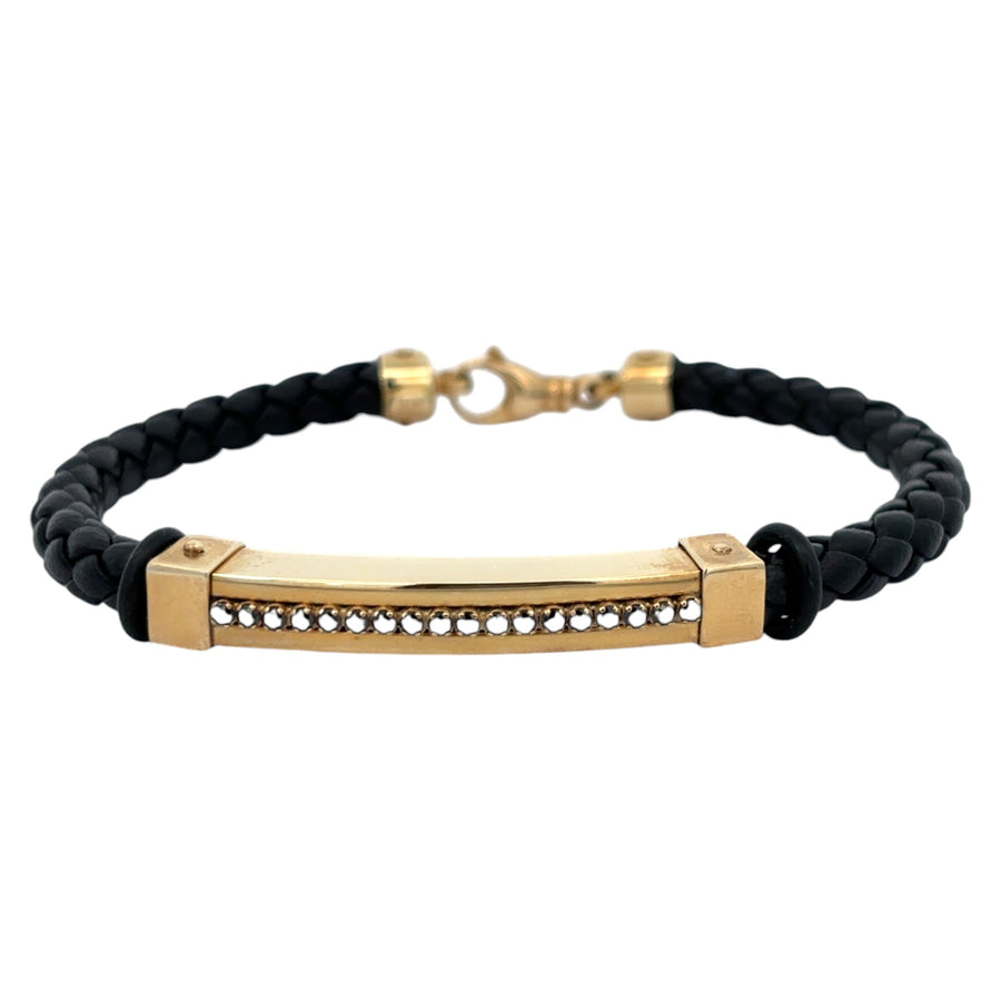 Men’s 14k gold and black leather bracelet displayed flat