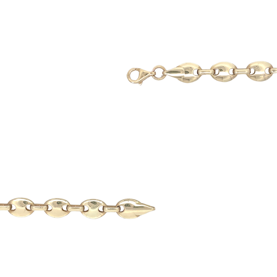 Woman modeling 19.7 cm gold bracelet with layered accessories
