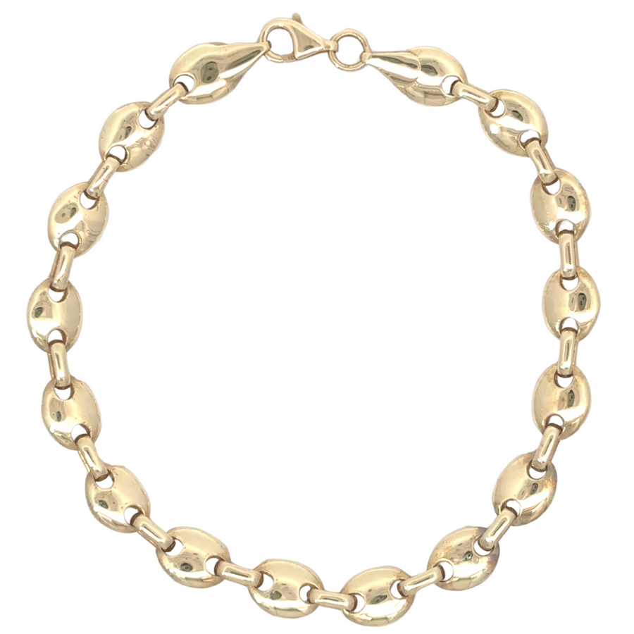 Close-up of clasp and links on 14k gold unisex bracelet
