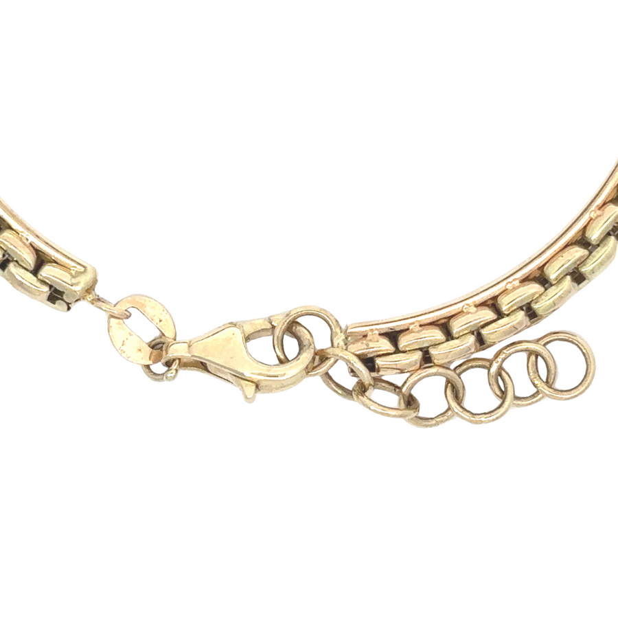 14k gold bracelet styled with a minimalist outfit, highlighting its timeless design.