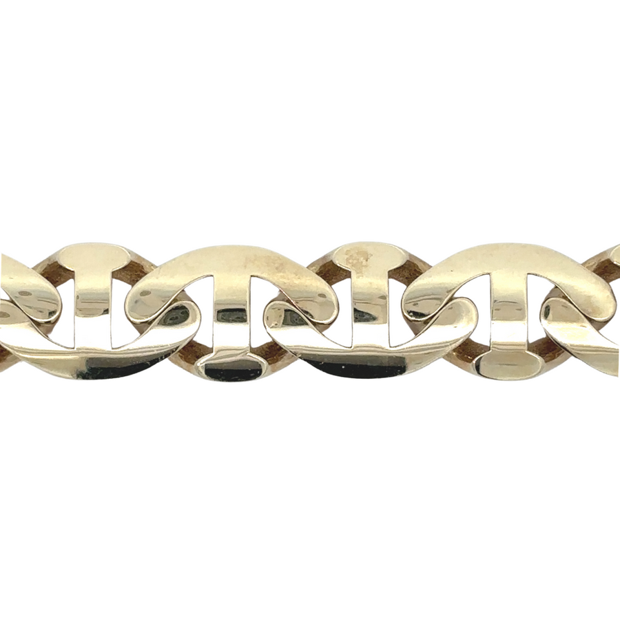 Detail shot of clasp and links on 14k gold bracelet
