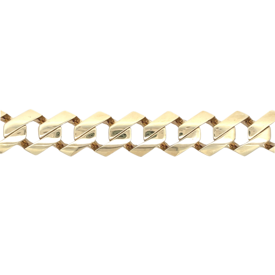 Man wearing 14k gold bracelet with a business outfit
