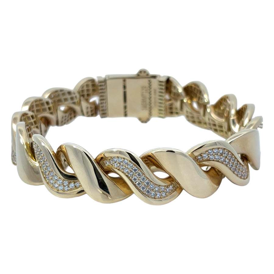 Close-up of elegant 14k gold bracelet with smooth finish