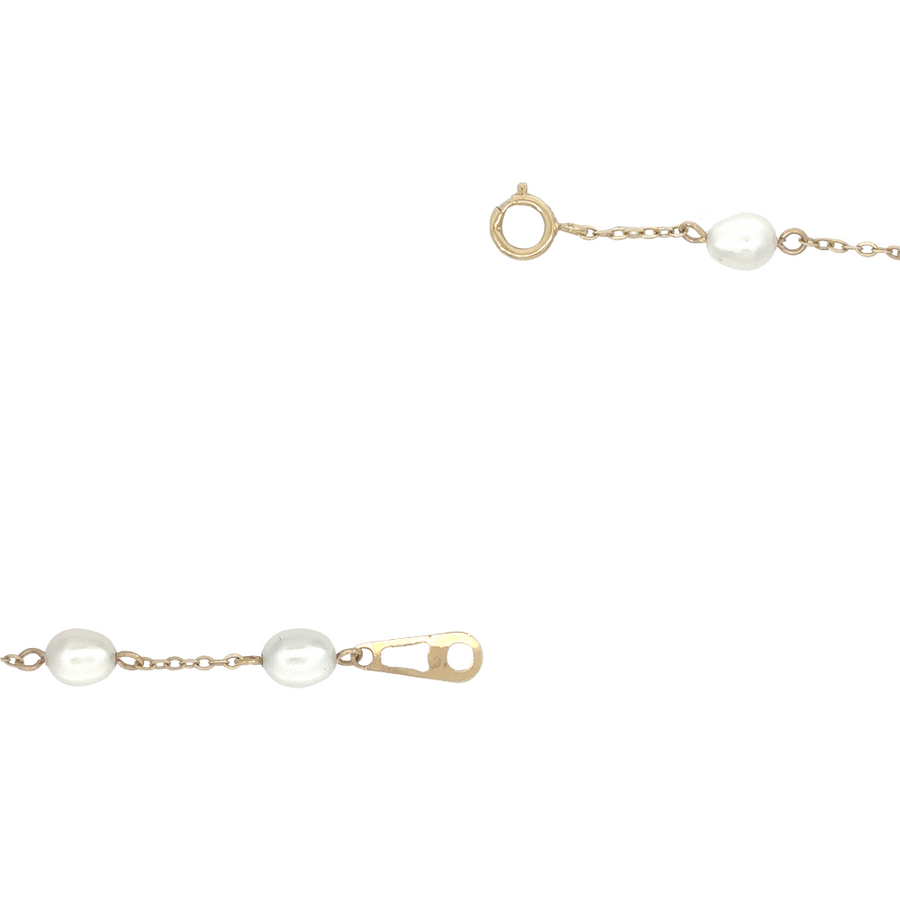 Bracelet with evenly spaced small pearls along gold links