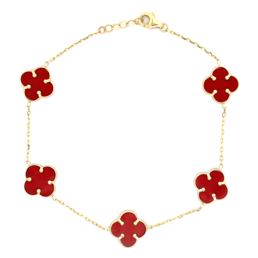14k gold bracelet with five small red accents on a white background