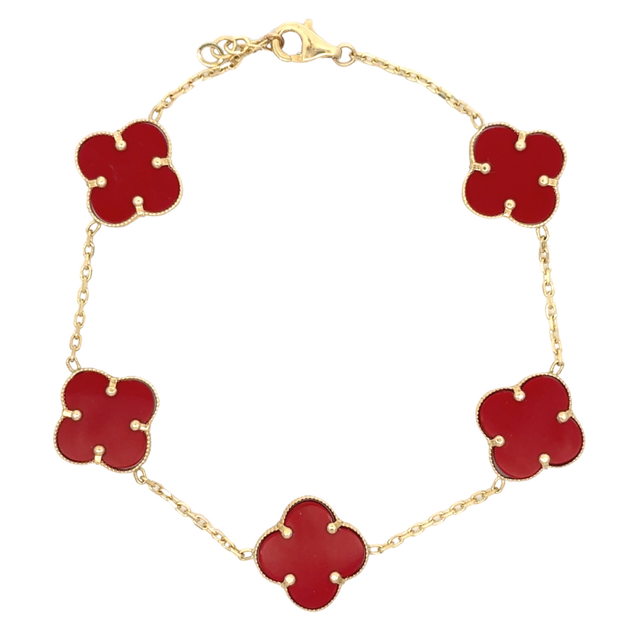 14k gold bracelet with five small red accents on white background