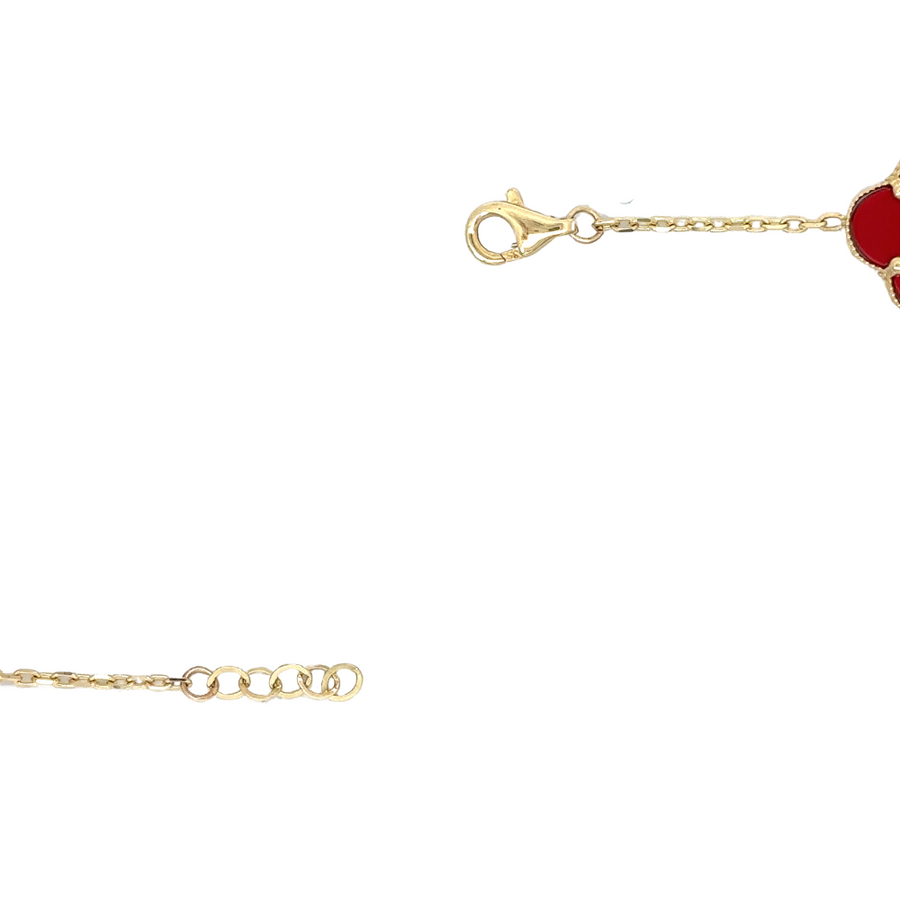Gift box with gold bracelet featuring five small red stones