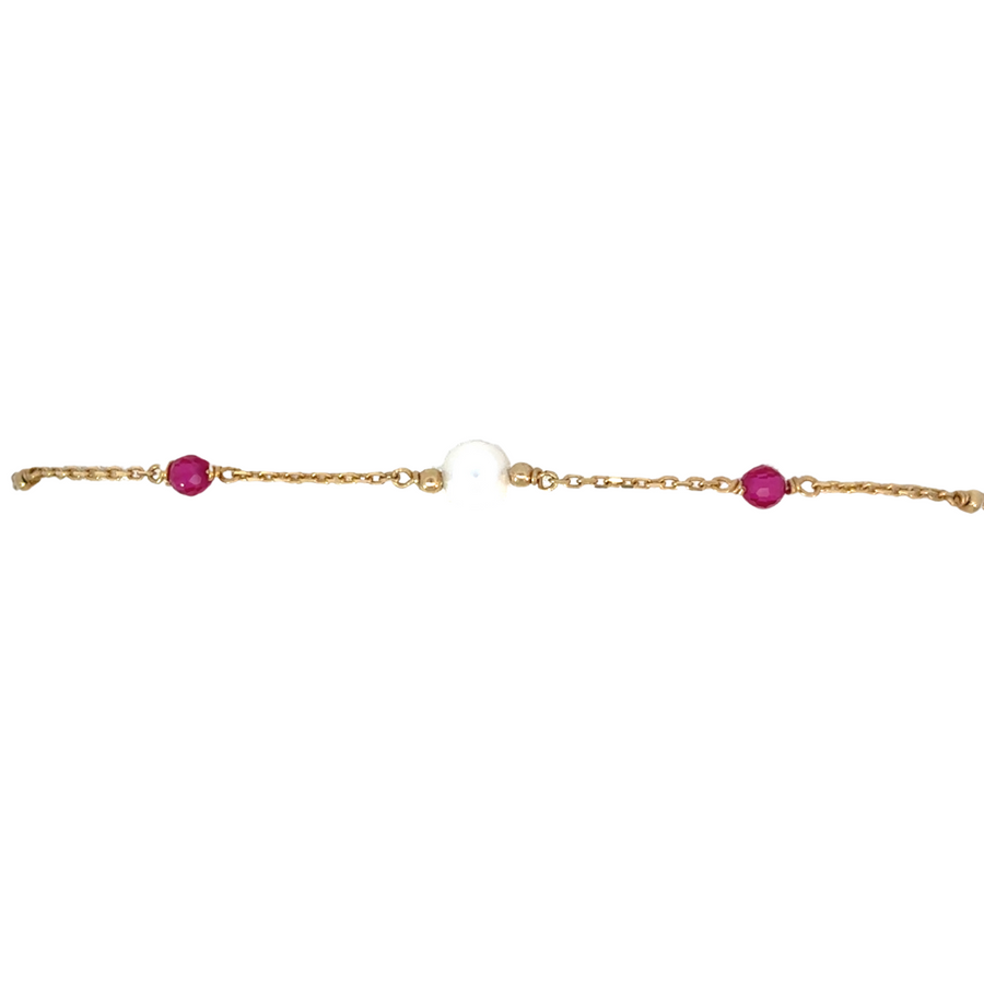Elegant gold bracelet with pearl center on white background