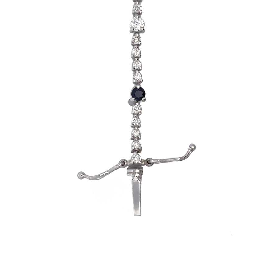 Close-up of sapphire and diamond details on gold bracelet