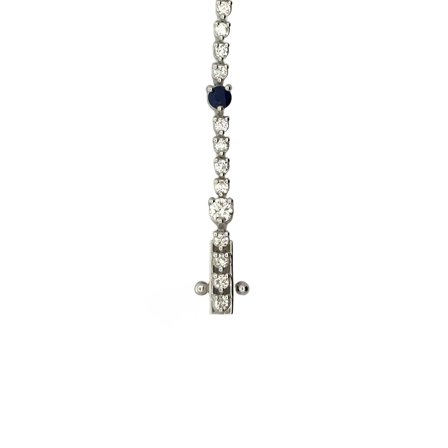 Side view of sapphire and diamond bracelet on white background