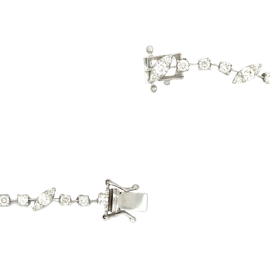 Elegant 14k gold bracelet featuring delicate diamond leaves