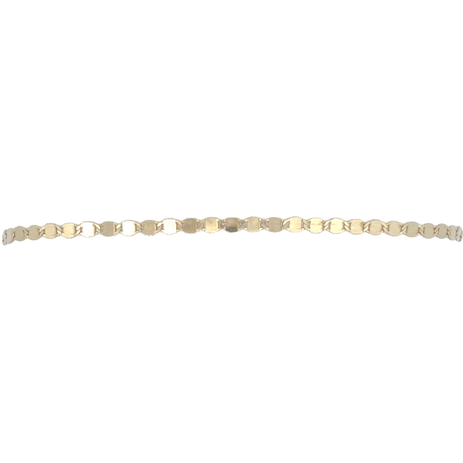 Flat-lay of mirror-link bracelet in 16.5 cm length displayed beside other gold jewelry