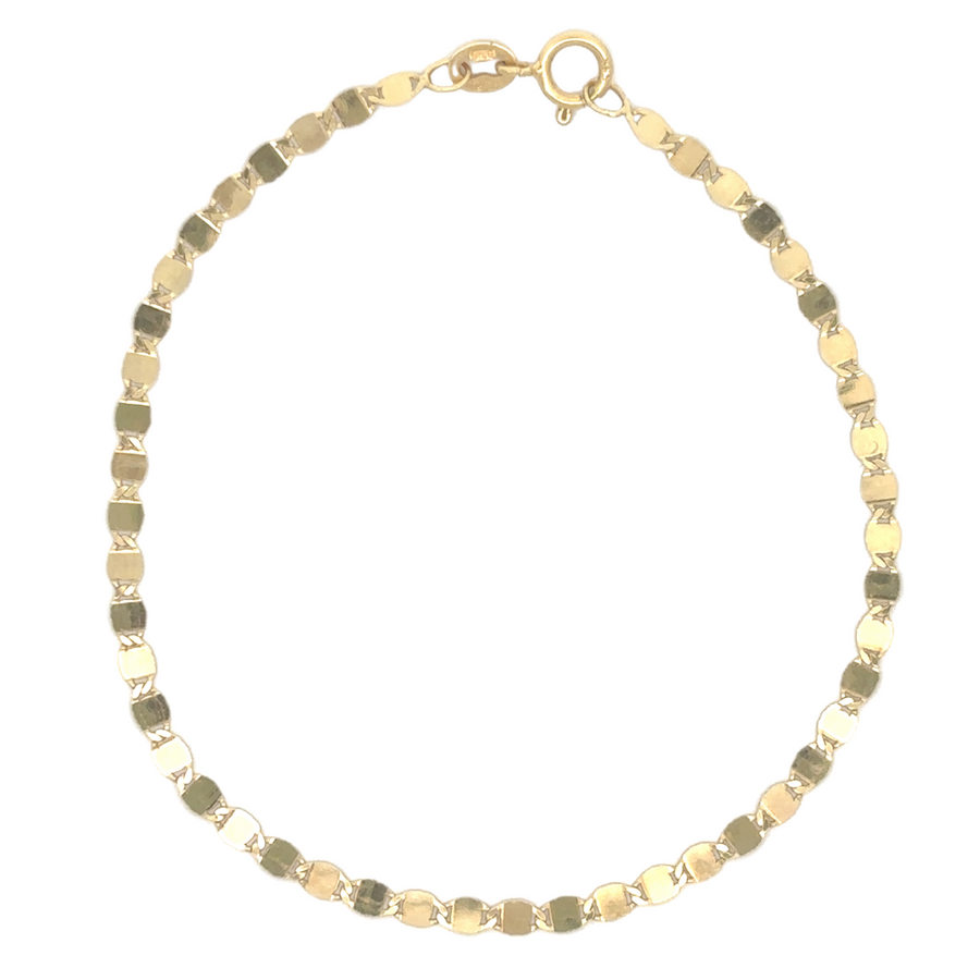 Close-up of 14k gold mirror-link bracelet on white background showing reflective detail