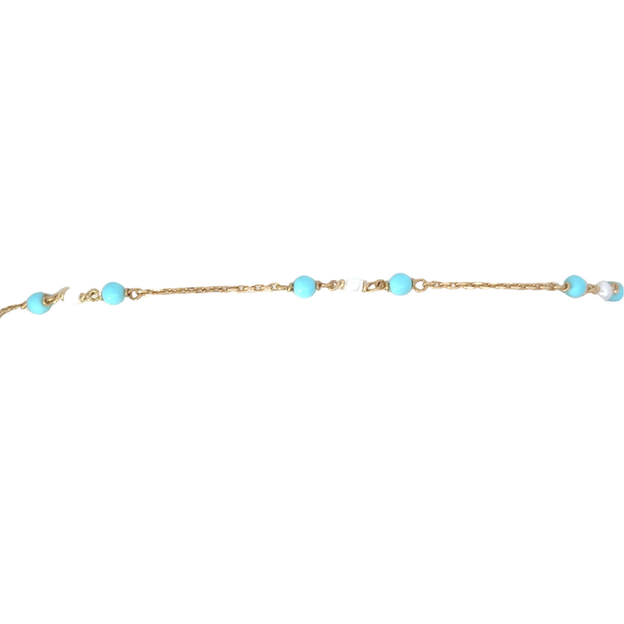 Elegant women’s bracelet with gold balls and pearls