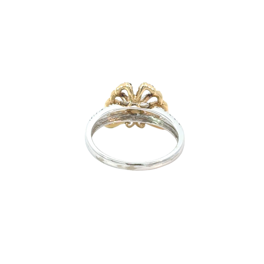 Lifestyle photo of a woman pairing the butterfly ring with a floral outfit.