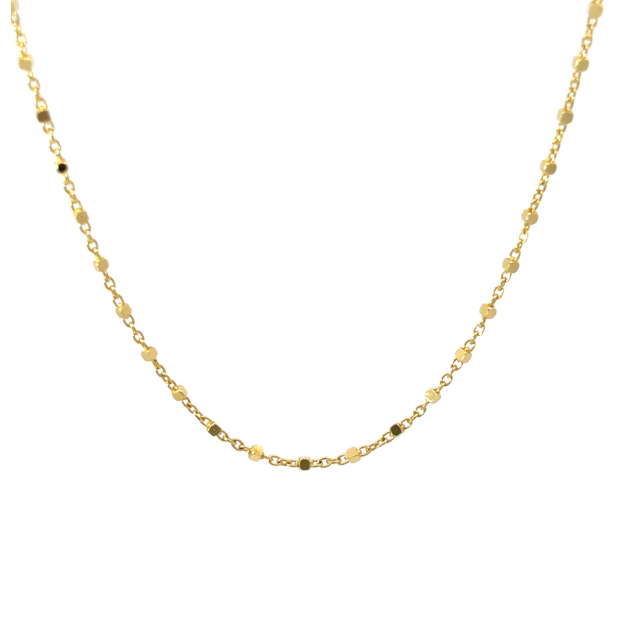 Flat-lay of 14k gold chain, 16.25 inches, on a white background