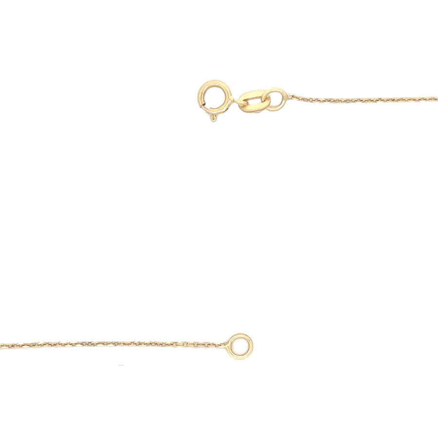 Unisex 14k gold necklace paired with pendant on a dark velvet display